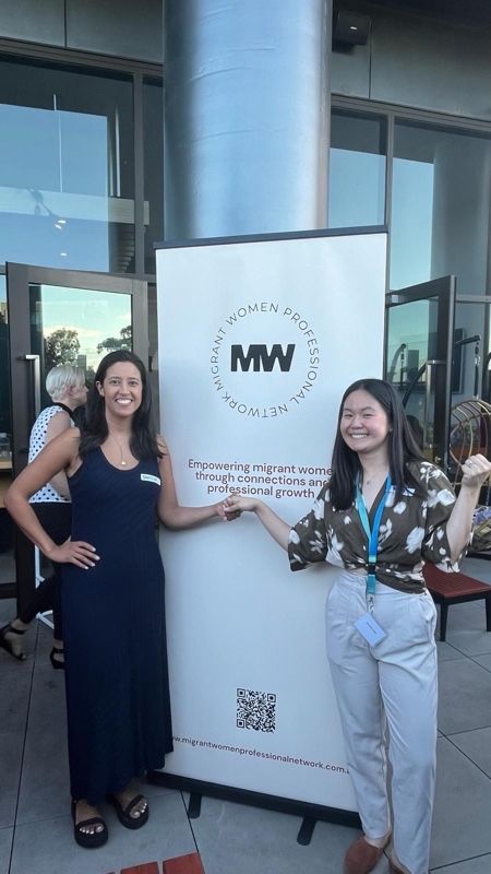 A photo holding hand between Kimberlyn (the MWP's founder) and her worker, showing the support each other