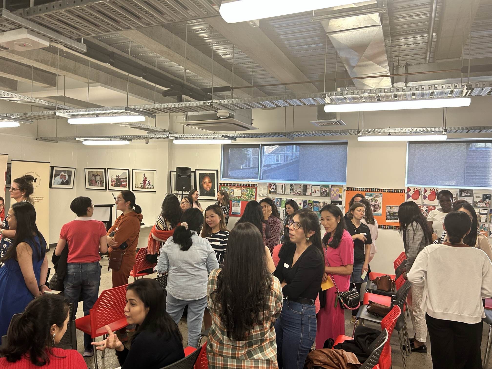 A picture capture the participant sharing their thoughts after the event and chatting at the event